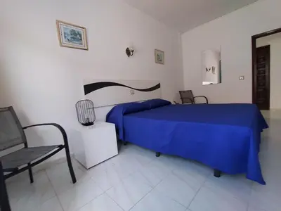 Cama o camas de una habitación en Hotel Rancho del Mar