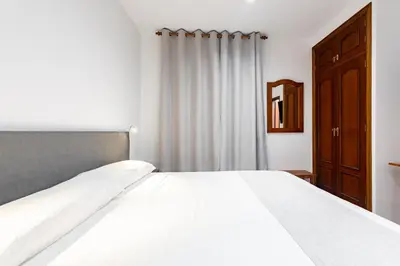 Cama o camas de una habitación en Hostal La Costa