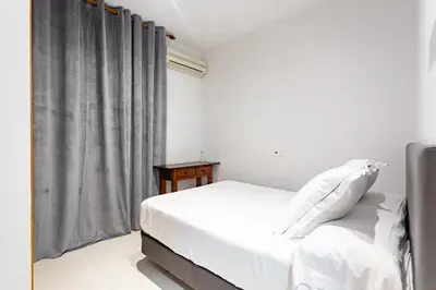 Cama o camas de una habitación en Hostal La Costa
