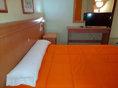 Cama o camas de una habitación en Hostal Carlos III