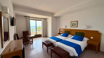 Cama o camas de una habitación en Hotel las Conchas