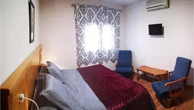 Cama o camas de una habitación en Hostal Los Hermanos