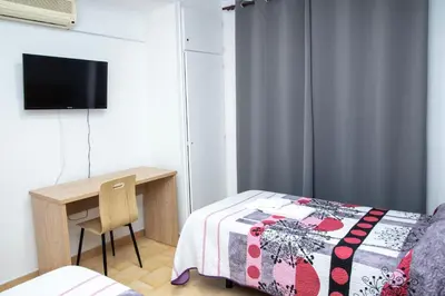 Cama o camas de una habitación en Pension Cuatro Vientos
