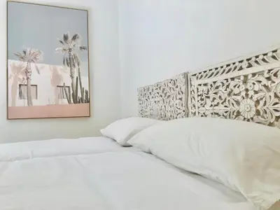 Cama o camas de una habitación en CalaLuna Mojácar - Precioso ático en Macenas Resort, con vistas panorámicas a mar y montaña