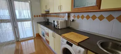 Una cocina o zona de cocina en Primera línea de playa Première ligne de mer