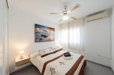 Cama o camas de una habitación en Apartamento Cala Higuera 80m2