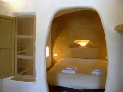 Cama o camas de una habitación en Cuevas Alcobas