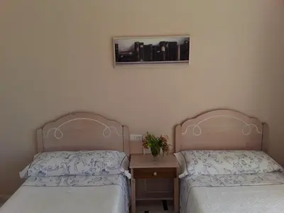 Cama o camas de una habitación en pension hernandez