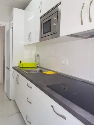 Una cocina o zona de cocina en Apartamentos Bajel