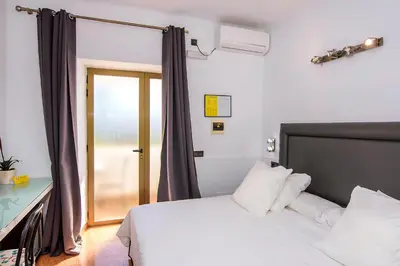 Cama o camas de una habitación en Family Agua Amarga