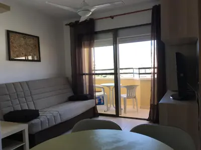 Una televisión o centro de entretenimiento en APARTAMENTO CERCA DE LA PLAYA