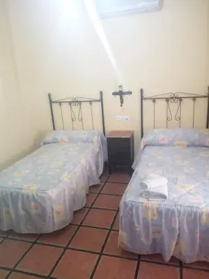 Cama o camas de una habitación en La Posada de Eustaquio