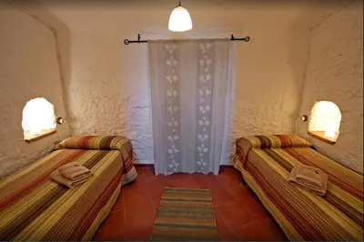 Cama o camas de una habitación en Charming rental with shared pool in Gorafe