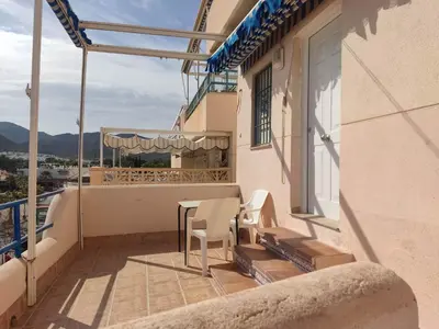 Un balcón o terraza de Apartamentos El Puerto