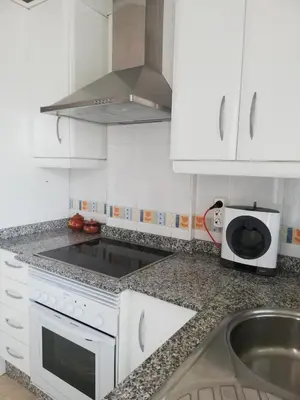 Una cocina o zona de cocina en LUJOSO ADOSADO de TRES HABITACIONES en VERA PLAYA A 200 METROS DEL MAR