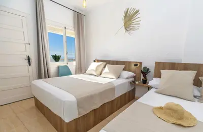 Cama o camas de una habitación en Maxcaly Playa