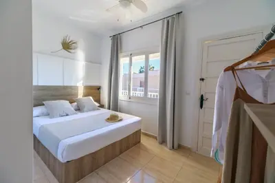 Cama o camas de una habitación en Maxcaly Playa