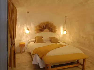 Cama o camas de una habitación en Cueva OTTO Familiar Privada