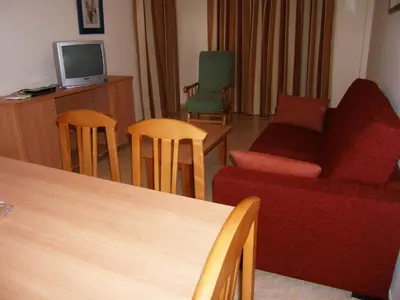 Una televisión o centro de entretenimiento en Apartamentos Cibeles