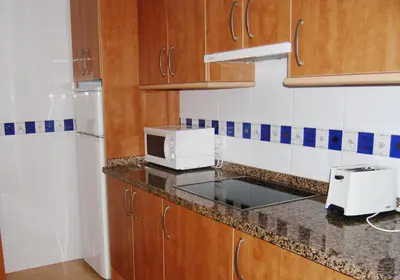 Una cocina o zona de cocina en Apartamentos Cibeles