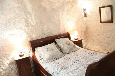 Cama o camas de una habitación en CUEVAS AL ANDALUS - Alegria