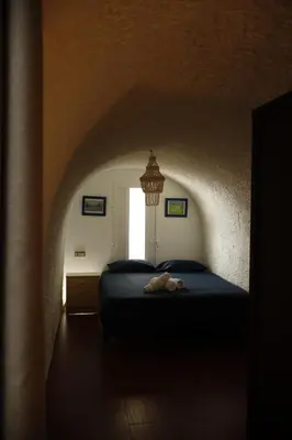 Cama o camas de una habitación en CASA CUEVA PIENA, Alcudia de Guadix