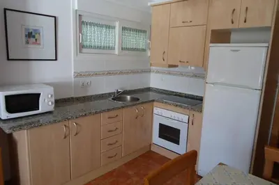 Una cocina o zona de cocina en Apartamento Cerca de la Playa con wifi