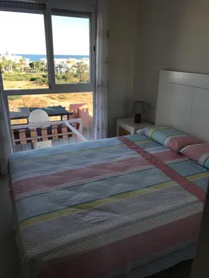 Cama o camas de una habitación en Atico con piscina privada y vistas al mar