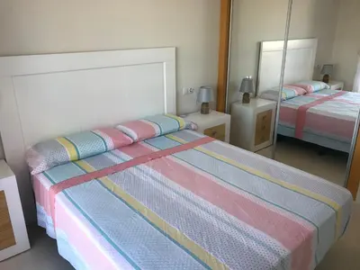 Cama o camas de una habitación en Atico con piscina privada y vistas al mar