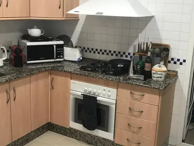 Una cocina o zona de cocina en Palacio De La Marina