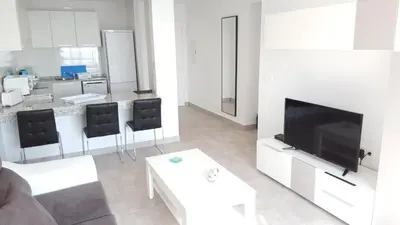 Una televisión o centro de entretenimiento en Homes of Spain, Atalaya de Mojacar, Apartamento 3 dormitorios con vistas al mar y WIFI