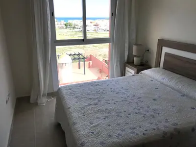 Cama o camas de una habitación en Atico con piscina privada vistas al mar