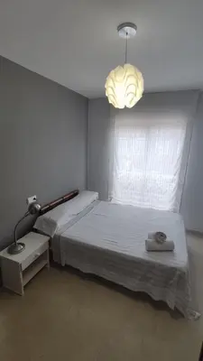 Cama o camas de una habitación en HABITACIONES CACHEMIRES en ALMERIA