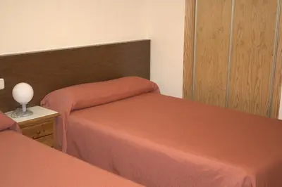 Cama o camas de una habitación en Hostal Casa Juan