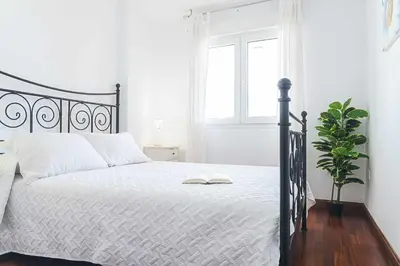 Cama o camas de una habitación en Casa Playa Roquetas