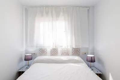 Cama o camas de una habitación en Apartamentos “Mar de Coral” Aguadulce