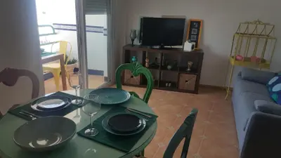Una televisión o centro de entretenimiento en Las Negras, WIFI con vistas al mar, 3º con Ascensor y AA