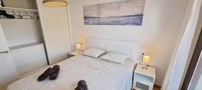 Cama o camas de una habitación en Homes of Spain, Apartamentos Paraíso Vera Playa, Ático Alborada con solárium grande privado, a pie de playa, WIFI