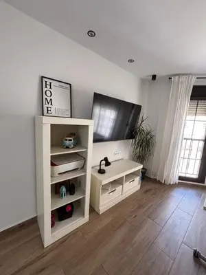 Una televisión o centro de entretenimiento en Apartamento a 1 MINUTO de la playa en GARRUCHA