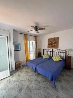 Cama o camas de una habitación en Duplex en urbanización con piscina comunitaria y wifi