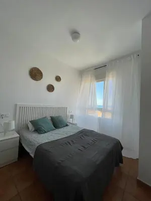 Cama o camas de una habitación en Apartamento y Piso frente al mar con vistas en Garrucha
