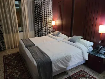 Cama o camas de una habitación en Hotel Amaltea by Executive Sport