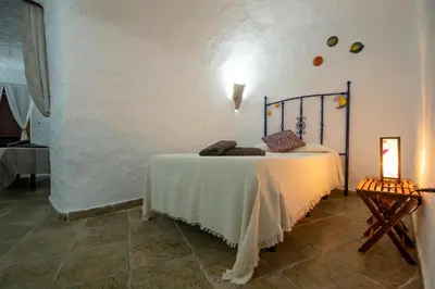 Cama o camas de una habitación en Alojamiento Cuevas Victoria