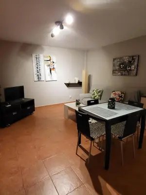 Zona de estar de Casa baja preciosa con jardín privado en primera línea naturista!