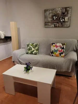 Zona de estar de Casa baja preciosa con jardín privado en primera línea naturista!