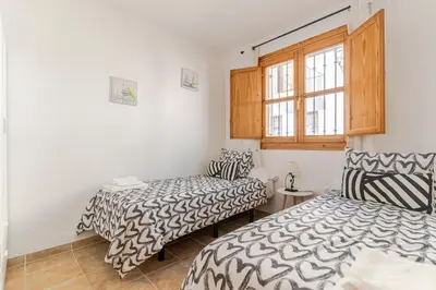 Cama o camas de una habitación en RentitSpain - Picena - Casa Picena Terraza y Senderismo en la Montaña