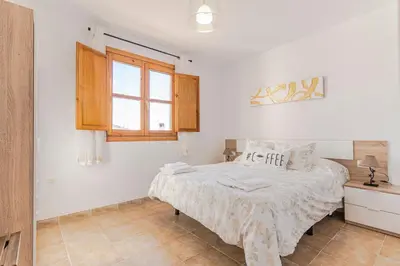 Cama o camas de una habitación en RentitSpain - Picena - Casa Picena Terraza y Senderismo en la Montaña
