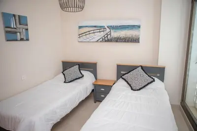 Cama o camas de una habitación en Mundo de sol golf et plage
