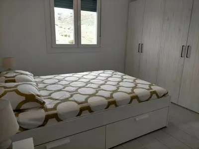 Cama o camas de una habitación en Precioso loft con piscina comunitaria