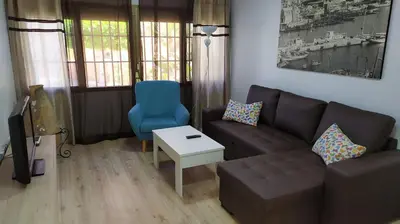 Zona de estar de Atractivo apartamento en la playa con parking
